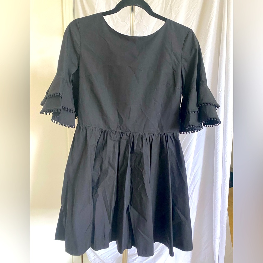 Mini flow dress with open back. Worn only twice !